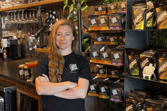 Annie Rouse confidently posed inside the Cannabuzzery Bar with products in background